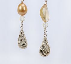 Asymmetrical, gold drop earrings begin with our vanilla beans, continue with citrine, layer on golden freshwater pearls, and end with intricately textured gold leaves. All gold is 14kt yellow. An approximate 4" drop. Vanilla Beans, Earrings Fall, Golden Leaves, Gold Leaves, White Orchids, Gold Drop Earrings, Gold Texture, Vanilla Bean, Gold Leaf