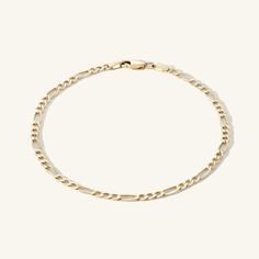 2.6mm Figaro Chain Bracelet. This brand new chain style is reminiscent of chains of days past and lays on the body like liquid gold. Classic Figaro Chain Bracelet With Oval Links, Elegant Figaro Chain Link Bracelet, Classic Figaro Chain Bracelets, Elegant Figaro Chain Bracelet, Everyday Gold Figaro Chain Link Bracelet, Classic Figaro Chain Gold Bracelet, Classic Gold Figaro Chain Bracelet, Dainty Bracelet With Figaro Chain Link, Dainty Figaro Chain Link Bracelet