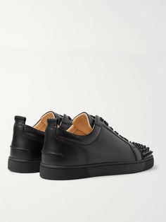 The 'Louis Junior' low-tops are a core design in Christian Louboutin's sneaker collection, and this 'Spikes' version perfectly melds the label's classic appeal and rock 'n' roll flare. They're made from smooth black leather, fitted with sleek tonal eyelets and laces, and finished with conical hardware on the toecaps. Wear them with slim, dark jeans. Louboutin Collection, Christian Louboutin Sneakers, Saint Laurent Jeans, Core Design, Sneakers For Men, Dark Jeans, Lace Fashion, Sneaker Collection, Mr Porter