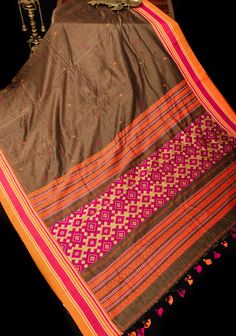 Discover the timeless charm of this Brown Bengal Cotton Saree, a perfect blend of traditional artistry and effortless elegance. The saree features a rich brown hue that offers a warm and earthy foundation, making it a versatile choice for a variety of occasions. Crafted from high-quality Bengal cotton, it ensures a comfortable, breathable drape that is both practical and stylish. The saree is adorned with a distinctive stack border, which adds a touch of traditional flair with its intricate patterns and detailed craftsmanship. This border frames the saree with a classic design that enhances its overall elegance. Complementing the border are beautiful Meenakari buttas, which introduce vibrant and intricate motifs to the fabric. These Meenakari buttas, known for their colorful and artistic d Framed Saree Fabric, Bengal Cotton Sarees, Contrast Blouse, Cultural Events, Effortless Elegance, Intricate Patterns, Cotton Saree, Salwar Kameez, Design Element