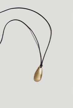 Large Pebble Pendant Necklace Gold Cord | Latest Collection Necklaces Online - Maslo Jewelry Silk Cord Necklace, Pebble Pendant, Pendant Necklace Gold, Silk Cord, Lemon Quartz, Hand Cast, Quartz Earrings, Brass Jewelry, Natural Material