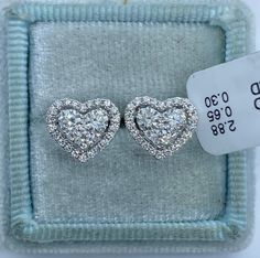 Stunning Heart Diamond Stud Earrings.  Excellent craftsmanship, the diamonds are bright and very sparkling.  The center diamonds are nice size, all set smooth.  The shape is very pretty.  Nice and solid backings for a secure fit.  These diamond studs are simply classy and beautiful.  Heart measures 10.5x9.1mm.  Genuine Diamonds total weight: 0.93 Carats  Clarity: VS/SI1 Color: F All white and shiny diamonds, no cloudy or yellowish stones  18K white gold 2.88 grams  Comes with gift box * We have been in the wholesale Jewelry business for over 30 years serving the community at the same location. All diamonds we use are natural stones and fine quality gold. Absolutely NO clarity enhanced or treated diamonds. Our jewelry pieces are handcrafted with fine craftsmanship and good quality stones. O Gia Certified Heart-shaped Diamond Jewelry, Valentine's Day Diamond Cut Round Diamond Earrings, Valentine's Day Round-cut Diamond Earrings, Vvs Clarity Diamond Earrings For Valentine's Day, Luxury Heart-shaped Diamond Cut Earrings, Vvs Clarity Heart Cut Diamond Earrings, Valentine's Day Round Diamond Earrings With Vvs Clarity, Double Heart Diamond Earrings For Anniversary, Heart Cut Diamond Earrings With Vvs Clarity