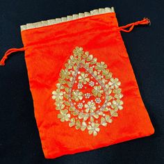 "Jaipuri Gota Patti Potli Bag/ Designer Embroidered Potli/ Wedding Bags For Women/ Embroidered Purse/ Potli Bag/ Gota work Wedding Bag Description: Made in Colorful Leheriya Cloth with Golden Hand Embroidery with Gota Patti Size -: Length- 8\" , width- 6\" Material -: Shimmer Cotton, Gota Patti, Beads Best Gift item for Mehendi/ Mayun/ Haldi/Wedding Function. Used to carry earrings, rings, bracelets, and other jewelry items.  Other usages as storage for necklaces, bangles, and other accessories Diwali Party Embroidered Fabric With Motifs, Bollywood Style Rectangular Potli Bag With Dori Work, Gold Rectangular Potli Bag For Festive Season, Festive Gold Rectangular Potli Bag, Festive Embroidered Gold Clutch, Embroidered Rectangular Potli Bag For Diwali, Handwork Rectangular Potli Bag For Diwali, Red Embroidered Potli Bag For Party, Traditional Embroidered Fabric With Motifs For Party