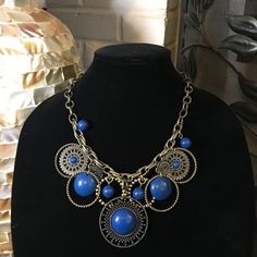 Bold And Blue! Statement Necklace With Stunning Blue/Indigo Detailing On A Single Chain Design. Comes With Matching Earrings (Picture To Come Soon). Still In Original Packaging. Necklace Worn Once, Earrings Never Worn. Adjustable Nickel Free Blue Jewelry, Blue Brass Jewelry For Jewelry Making, Blue Beaded Metal Jewelry, Elegant Blue Decorative Jewelry, Blue Jewelry With Adjustable Chain And Round Pendant, Metal Beaded Jewelry For Accessorizing, Beaded Metal Jewelry For Accessorizing, Handmade Blue Costume Jewelry, Blue Dangle Jewelry With Adjustable Chain