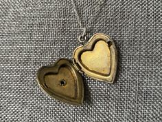 This vintage sweetheart necklace bears a US Navy insignia on a heart-shaped locket. The locket is hallmarked 10K gold-filled sterling from D'Aguanno Bros. The chain is a new, 14K gold-filled, and measures 18 inches. This piece has been restored as close as possible to its original condition, cleaned gently by hand with steam, polishing cloths, and good old-fashioned elbow grease.This vintage item has been loved and cherished by a previous owner, there will be some slight wear or imperfections. I Vintage Charm Heart Pendant Necklace For Anniversary, Anniversary Necklace With Vintage Charm And Heart Pendant, Vintage Antique Gold Heart Pendant Necklace, Antique Gold Heart Pendant Vintage Necklace, Vintage Necklace With Heart Charm, Vintage Necklace With Heart Charm For Gift, Vintage Necklace With Heart Charm As Gift, Vintage Heart Charm Necklace For Valentine's Day, Vintage Heart Charm Necklace As Gift