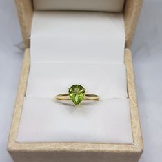 14k solid yellow gold natural AAA quality pear shaped peridot gemstone ring. 1. The weight of natural peridot gemstone used in the ring =1.15 cts. 2. The weight of 14k solid yellow gold used in the ring =1.180 grms 3. The peridot is the birthstone for the people born in the month of August. 4. The design of the ring is very nice and beautiful. 5. I have used all my skills and experience to manufacture this ring as beautiful as I can and I do hope that my work will be appreciated. 6. I CAN PROVID Yellow Gold Peridot Birthstone Ring, Green Pear-shaped 14k Gold Rings, Yellow Gold Peridot Ring For May Birthstone, Yellow Gold Peridot Solitaire Birthstone Ring, 14k Yellow Gold Pear-shaped Ring, Yellow Gold Peridot Promise Ring, Peridot Rings In Yellow Gold For Promise, Yellow Gold Peridot Rings For Promise, Yellow Gold Peridot Solitaire Rings