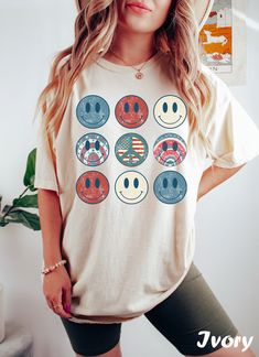 Get ready to rock that casual chic look with our 4th of July Smiley Face T-shirt ❤️ Get retro with this Graphic Tee! Featuring smiley face and a nostalgic vibe, this design is perfect for all the cool Americans out there. Show off your retro style and spread some positive vibes with this fun and funky t-shirt. ❤️ Size up, babe! Go 1-2 sizes bigger for that oversized stunner. Elevate your style, own the spotlight, and unleash your fashion power. It's time to rock the room with your effortlessly c Retro American Flag Print Summer T-shirt, Multicolor Tops With Front Print For Summer, Summer Flag Print T-shirt With Relaxed Fit, American Retro Graphic Print Summer Tops, Retro Cotton Tops For 4th Of July, Retro Cotton Top For 4th Of July, Trendy Cotton T-shirt For Independence Day, Fun Cotton Shirt For Independence Day, Fun Independence Day Cotton Shirt