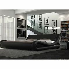 a modern bedroom with black and white decor