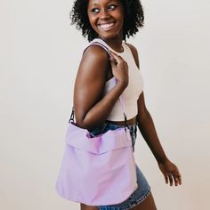 Meet your new BFF - the Carrie Catch All Shoulder Tote Bag! This trendy athleisure bag is perfect for gym days, running errands, or just looking stylish on the go. Comes in multiple colors including black, white, fuchsia, and lilac. Includes a removable strap, inner zipper pocket, and middle divider that also has a zipper pocket for all your essentials. Plus, a latch closure for extra security. The Carrie Catch All Shoulder Tote Bag is another addition to our 3 Sisters Collection! This collectio Everyday Reusable Nylon Bags, Reusable Nylon Bags For Everyday Use, Versatile Purple Nylon Shoulder Bag, Functional Reusable Everyday Bags, Functional Everyday Reusable Bags, Functional Reusable Bags, Casual Travel Shoulder Bag With Water Bottle Pocket, Trendy Shoulder Gym Bag For Everyday Use, Trendy Shoulder Gym Bag For Travel