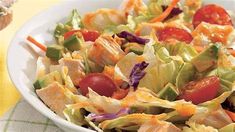 a white bowl filled with salad and dressing