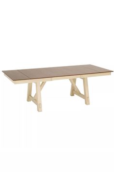 a wooden table sitting on top of a white floor