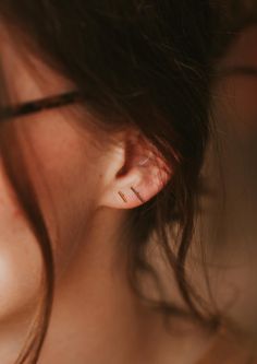 These simple studs are officially raising the BAR. Pair with your other favorite earring—we love combining these with anything from our MINI Collection, or wear these as the main act. A favorite, versatile, everyday stud. Bar measures 1mm x 10mm or 1mm x 6mm. Sold as a pair. Shown on Abbie with our Tiny Twist Earrings. Available in 14kt Gold Fill + Sterling Silver. Our jewelry is handmade so each piece will be unique and may vary slightly from what is pictured. Simple Everyday Earrings, Poppy Ring, Simple Studs, Twist Earrings, Horseshoe Earrings, Bolo Necklace, Everyday Wear Jewelry, Earring Sets, Mini Collection