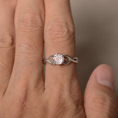 This is a gorgeous handmade creation. Its beauty is its simplicity & Elegance. The 6*6 mm round shape faceted natural Morganite is crafted in solid sterling silver and with rhodium plated. All item is sent in a beautiful gift box If you have any idea of design your ring,pls contact me directly. You can realize more lovely stuff clicking the link https://www.etsy.com/shop/knightjewelry?refshopsection_shophome_leftnav Please leave the correct address and you phone number for delivering success Minimalist Diamond White Ring With Center Stone, Minimalist Round Cut Promise Jewelry, Diamond White Infinity-shaped Jewelry With Diamond Cut, Infinity Shaped Diamond White Jewelry With Diamond Cut, Diamond White Infinity Jewelry With Diamond Cut, Minimalist Cubic Zirconia Wedding Ring, Diamond Cut Infinity Jewelry In Diamond White, Adjustable Solitaire Promise Rings, Minimalist White Gold Crystal Ring With Round Cut