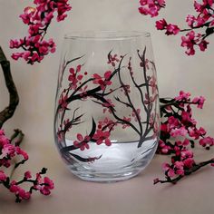 Hand painted cherry blossom wine glasses make a perfect gift, either alone or paired with a nice bottle of wine. Tuck inside a gift bag or create a simple gift basket for a finishing touch and you have the perfect gift for any occasion. Delicate black tree limbs with elegant tiny pink flowers and red centers around the glass. Keep for yourself and enjoy a glass of pinot on a summer evening. ITEM DETAILS: 🤍The price listed is for one glass…order just one glass for yourself or more for a friend! Painting Glass Cups, Small Glass Bottle Crafts, Wine Cup Painting Ideas, Painted Wine Glasses Ideas Simple, Simple Gift Basket, Wine Glass Painting Ideas Easy, Glass Cup Painting, Painted Stemless Wine Glasses, Wine Glass Painting