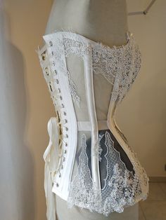 "✨\"Night Jasmine\"✨ corset, the second born out from my new collection 🌸\"Flower Couture\"🌸. . It's a plungie steelboned corset made in white cotton satin and mesh, decorated with delicate and beaded quality lace. All lace is handsewn and It's surely a piece of Haute Couture. It's made to order on your personal measures, so please, before placing an order count at least 3 weeks to be ready to ship. ------------------------------------------------------------- Facebook: https://www.facebook.co Flower Couture, Night Jasmine, Victorian Lingerie, Gothic Victorian, White Corset, Wedding White, Victorian Rings, Net Fabric, Full Look