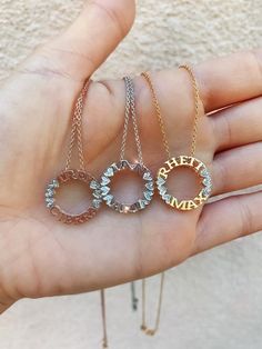 The mini version of our Circle Name Necklace. A memorable and meaningful gift for any occasion or holiday. It's perfect for mom, sisters, best friends, cousins, bridesmaids, and more.This is our MINI Circle Name Necklace.For our STANDARD/CLASSIC version, visit the listing here: https://etsy.me/2voZKUzDETAILS- Crafted with pure sterling silver and optional gold-plating OR pure solid gold- Approximately 3/4" in diameter from outside of the letters- Chain style may vary slightly- Made in New York*N Elegant Name Necklace For Bridesmaid Gift, Elegant Name Necklace For Bridesmaids, Personalized Diamond Jewelry For Mother's Day, Mother's Day Diamond Jewelry With Initials, Sterling Silver Round Pendant Name Necklace For Mom, Rose Gold Pendant Name Necklace For Anniversary, Rose Gold Pendant Name Necklace For Wedding, Personalized Jewelry For Anniversary With Round Pendant, Delicate Engraved Jewelry As Gift For Mom