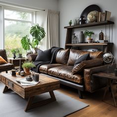 a living room filled with lots of furniture and plants on top of wooden tables in front of large windows