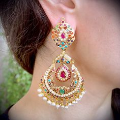 Featured is a pair of oversized chandbali / Brijbala earrings in 22k gold embellished with navratan color stones: rubies, emeralds, pearls, coral, turquoise (pheroza), sapphire and garnet. The earrings weigh 35.5 gms and are approx 3 inches in length. A perfect gift option under 2 lacs. 22k Gold Jewelry Necklaces, 22k Gold Jewelry, Chandbali Earrings, Pearl Necklace Set, Color Stones, Gold Jewelry Necklace, Jewelry Techniques, Emerald Necklace, Gold Bangle Bracelet