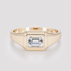 "Men diamond  engagement ring made from  solid 14K yellow gold.  Minimalist Solitaire Ring featuring a stunning emerald cut diamond. This sleek and modern design is perfect for both men and women, making it a versatile and timeless piece of jewelry. The emerald cut diamond takes center stage in this elegant ring, with its unique shape and beauty capturing the light to create a mesmerizing sparkle. Free engraving can be added by choice. **Please note that personalized items can not be returned or 14k Gold Emerald-cut Birthstone Ring With Diamond Cut, 14k Gold Emerald Cut Diamond Birthstone Ring, 14k Gold Birthstone Ring With Emerald Cut Diamond, Classic 14k Gold Ring With Bezel Setting, Classic Emerald Diamond Promise Ring, Classic Emerald Signet Ring With Bezel Setting, Timeless Yellow Gold Signet Ring With Emerald, Timeless Yellow Gold Emerald Signet Ring, Timeless Emerald Cut Birthstone Ring In 14k Gold