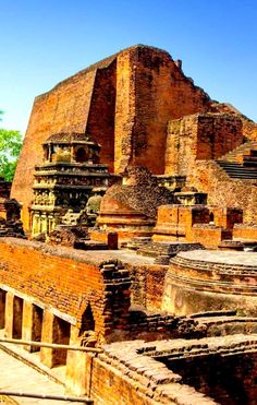 the ruins of an ancient city are surrounded by trees