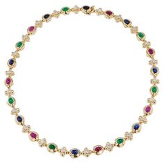 Admire the exquisite brilliance of the Multi-Color Yellow Gold Estate Necklace, featuring 8 Sapphires, 7 Rubies, 7 Emerald Cabochons, and 22 Diamonds totaling approximately 1.75 carat total weight. G/H in color and SI1/SI2 in clarity. Crafted from 14 karat yellow gold in the 1980's, this truly unique piece is sure to add a luxurious touch to any ensemble. This beautiful piece measures 16 inches in length. -Multi-Color Yellow Gold Estate Necklace -8 Sapphires, 7 Rubies & 7 Emerald Cabochons -22 Diamonds approx. 1.75ct TW G/H SI1/SI2 -14KT Yellow Gold -Circa 1980's Luxury Exquisite Cabochon Necklace, Sapphire Diamond Necklace, G H, Sapphire Diamond, Yellow Color, Unique Pieces, Diamond Necklace, Choker Necklace, Ruby