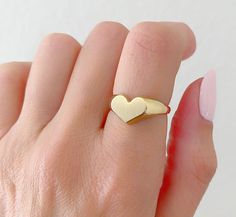 14K Solid Gold Heart Signet Ring. The Leading Trend In Jewelry Today. A Ring Full Of Love So You Can Keep It Close To Your Heart. A Beautiful Gift She Will Treasure Forever. Jewelry Comes In A Cute Gift Box Ready To Present. -All Jewelry Is New And Inspected For Quality Assurance. -Jewelry Is Crafted In Genuine High Quality 14K Gold. -We Do Not Sell Gold Plated. Product Detail: Metal: 14k yellow gold Weight: 4.6 grams Width: 2.2mm Size: 6 1/2 -Engrave Initial Upon Request -Feel Free To Ask Me An Heart-shaped Signet Ring With Polished Finish For Anniversary, Heart Shaped Signet Ring For Valentine's Day, Heart-shaped Signet Ring For Valentine's Day, Heart-shaped Rings With Polished Finish For Wedding, Valentine's Day Heart Shaped Signet Ring In Fine Jewelry, Heart-shaped Polished Wedding Ring, Valentine's Day Heart Shaped Fine Jewelry Signet Ring, Heart-shaped Wedding Rings With Polished Finish, Heirloom Heart-shaped Signet Ring For Gift