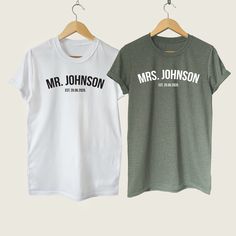 two t - shirts hanging on a clothes rack with the words mr and mrs johnson printed on them