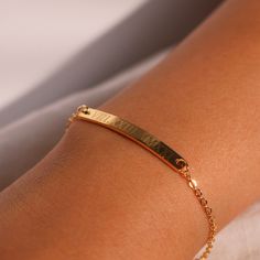 "This engraved bracelet features Roman numerals, adding a touch of personalization and elegance. Crafted with care, it's the perfect gift choice for her, reflecting both your thoughtfulness and the sentiment behind the date. Embrace the beauty of personalized jewelry and make her feel cherished with our Personalized Roman Numeral Bracelet, a meaningful and stylish accessory that she'll love to wear and treasure. #YOU MAY LIKE THIS silver bar cotton bracelet https://www.etsy.com/listing/149277659 Classic Personalized Charm Bracelet For Anniversary, Classic Name Bracelet As A Gift, Classic Name Bracelet For Mother's Day Gift, Elegant Personalized Charm Bracelet With Nameplate, Elegant Custom Name Charm Bracelet As Birthday Gift, Elegant Custom Name Charm Bracelet For Birthday, Elegant Nameplate Charm Bracelet For Gift, Elegant Custom Name Charm Bracelet For Birthday Gift, Elegant Nameplate Charm Bracelet Gift