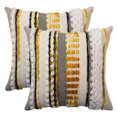 three decorative pillows with yellow and grey stripes