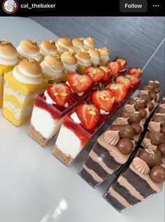 a table topped with lots of different types of desserts