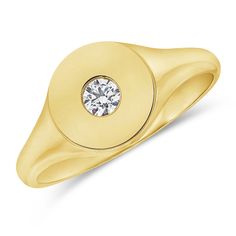 a yellow gold ring with a diamond in the center and a circular design on it