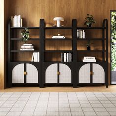 a living room with bookshelves and plants on the shelves in front of it