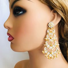 Beautiful and Unique Style Affordable Luxury traditional Bollywood Chandbali earrings with Kundan stones and Colored ruby semi precious Stones. 22k gold plated jewelry Length: Approx. 3 Inches Click here to see the complete collection of Kundan and Polki Statement Earrings at AryaFashions: https://www.etsy.com/shop/AryaFashions?section_id=25872820 Follow us on social media for new and latest designs: Facebook: www.facebook.com/shoparyafashions Pinterest: www.pinterest.com/aryafashions Instagram: Elegant Kundan Chandbali Chandelier Earrings, Kundan Multi-stone Chandbali Earrings, Dual-tone Kundan Chandbali Earrings, Luxury Kundan Bollywood Chandelier Earrings, Pink Kundan Chandelier Earrings, Kundan Chandbali, Jewelry Kundan, Kundan Jewelry, Chandbali Earrings