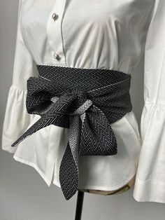 Double sided wide belt in black and black with white. The belt is suitable for long and medium length shirts, dresses and tunics. Goes great with a skirt or pants. It is made in several sizes. Size is determined by waist circumference. A great addition to your look. We produce quality garments for sustainable fashion.  Join our audience for special discounts with promo codes.  Copy the link below into your browser and confirm your subscription from the email you will receive.  https://mailchi.mp Black Fabric Belt For Summer, Spring Black Belted Corset Belt, White Fabric Belt For Summer, Black Corset Belt For Spring, Chic Black Belts For Spring, Cloth Belt, Belt For Women, Obi Belt, Wrap Belt