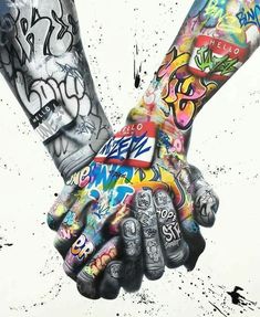 two people holding hands with graffiti all over their body and arms, both covered in multicolored spray paint