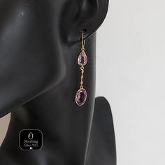 These dangling earrings exude timeless elegance. They are meticulously crafted from high-quality 925 sterling silver, enhanced with an 18-carat gold plating for an extra touch of luxury. Each earring is adorned with two magnificent natural amethysts, adding an even more sumptuous touch to their captivating design. Their design is inspired by the iconic scene of Rose on the Titanic's deck, capturing the grace and beauty of that legendary era. The enchanting amethysts add a touch of refined charm Long Drop Gemstone Earrings For Formal Occasions, Elegant Hallmarked Teardrop Earrings, Hallmarked Long Drop Jewelry, Oval Rose Gold Sterling Silver Earrings, Pierced Drop Earrings In Rose Gold, Rose Gold Pierced Drop Earrings, Handmade Elegant Long Drop Teardrop Earrings, Luxury Lever Back Earrings As Gift, Elegant Rose Gold Sterling Silver Linear Earrings