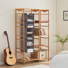 a bed room with a guitar and some shelves