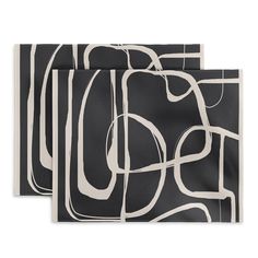 two black and white napkins with abstract designs