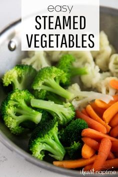 broccoli, carrots and cauliflower are in a bowl