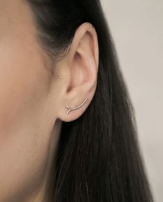 Inspired by a simplicity of a tree twig, this earring organically follows your earlobe and defines your style. Its minimalist and unique design gives you a feeling of lightness, distinctiveness and beauty. You'll fall in love with it from the very first time you wear it! No unnecessary details, just pure subtlety. On top of that, it's really comfortable to wear. A 0.8 mm wire at the back holds your earring securely in place, so you'll even forget you're wearing it. You can choose a bare sterling Everyday White Gold Sterling Silver Ear Climbers, Modern Ear Climbers As A Gift, Sterling Silver Delicate Ear Cuff For Gift, Minimalist White Gold Ear Cuff As Gift, Minimalist White Gold Ear Cuff For Gift, Modern Sterling Silver Ear Climbers For Everyday, Modern Sterling Silver Ear Climbers As Gift, Sterling Silver Ear Climbers For Everyday, White Gold Minimalist Ear Cuff As Gift