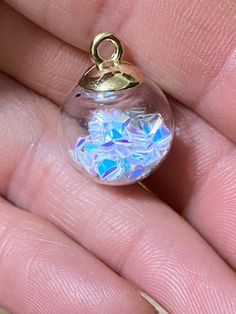 Cute clear glass globes with opal triangle confetti inside! Top is gold plate with loop. These would be cute as little girl jewelry! Loop is large enough to use a ribbon or cord! More colors of glass ball charms in shop! ball measures 16mm, loop ID 2mm spiritualnaturegifts.etsy.com New listings added daily! Be sure to favorite my shop! Thanks for looking! Glass Globes, Magical Jewelry, Posing Guide, Girl Jewelry, Fantasy Jewelry, Glass Ball, Glass Globe, Christmas Wishlist, Resin Jewelry