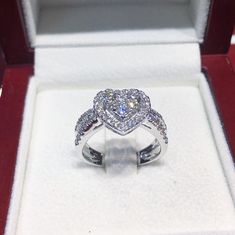 ONE OF A KIND DIAMOND & WHITE GOLD RING! SUGGESTED RETAIL VALUE: 3,950 HANDCRAFTED white gold ring! With super sparkling diamonds! Extremely white and clean! You will always be surprised by the sparkle! The middle part is designed to be an illusion of a 1.5 carat heart-shaped Diamonds (with 3 round brilliant diamonds). Set in 18K white gold ring! DIAMONDS: 48 Natural smaller, brilliant round diamonds weighting at 0.70 carat. All E/F (colorless) color, and VVS-VS quality Natural untreated dia Moissanite Heart Cut Diamond Ring For Proposal, Heart Cut Moissanite Diamond Ring For Proposal, Dazzling Heart Cut Diamond Ring, Dazzling Heart Cut Diamond, Wedding Rings In Heart Cut Diamond White, Luxury Heart Cut Diamond Wedding Ring, Diamond Heart Cut Ring For Proposal, Luxury White Heart Cut Wedding Ring, Heart Cut Diamond White Ring For Proposal