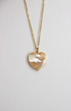 This delicate unique necklace was made of natural mother of pearl beige heart pendnat and high quality gold tone stainless steel chain with gold tone lobster claw. The chain is from lead & nickel free metal. Perfect jewelry for everyday wear and a great gift for someone special! The length of necklace is 45 cm or 17.7 inches. Other necklaces of my shop you can see here: https://www.etsy.com/shop/NaTavelli?section_id=14843046&ref=shopsection_leftnav_5 Thanks for a visit. Pearl White Mother Of Pearl Shell Necklace As Gift, Pearl White Mother Of Pearl Shell Necklace Gift, White Mother Of Pearl Pendant Shell Necklace, Elegant Round Pendant Charm Necklaces For Healing, Elegant Round Pendant Charm Necklace For Healing, White Pearl Necklace With Gemstone, Natural Stones Round Necklace For Her, Natural Stones Necklace Gift For Her, Natural Stones Necklace For Her