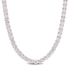 Feel like a princess in this classic Cubic Zirconia Tennis Necklace. Mounted in luminous rose plated sterling silver, it features 103 round-cut, sparkling cubic zirconia gemstones (4 x 4mm) embellished in a tennis motif for an elegant and bold look. Enhanced with a high polish finish, this CZ tennis necklace is 17-inches long and fastens with a pressure tongue clasp. This gorgeous gemstone tennis necklace is an ideal choice for today's contemporary woman. Sparkling Rose Gold Cubic Zirconia Necklace, Rose Gold Diamond Iced Out Necklace, Iced Out Rose Gold Diamond Necklace, Rose Gold Brilliant Cut Tennis Necklace For Anniversary, Anniversary Rose Gold Brilliant Cut Tennis Necklace, Dazzling Rose Gold Lab Grown Diamond Jewelry, Formal Rose Gold Diamond Tennis Necklace, Rose Gold Diamond Tennis Necklace For Formal Occasions, Iced Out Rose Gold Necklace For Formal Occasions