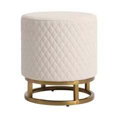 a white ottoman sitting on top of a metal stand