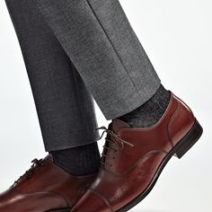 These classic brown Oxfords are crafted from supple calf leather in a flexible Blake stitch, and feature full leather lining and sole. Brown Oxfords With Branded Insole And Plain Toe, Classic Brown Oxfords For Business, Classic Brown Business Oxfords, Brown Plain Toe Oxfords, Business Casual Cap Toe Dress Shoes With Stitched Sole, Classic Brown Almond Toe Oxfords, Classic Brown Oxfords With Stitched Sole, Classic Brown Oxfords With Leather Sole, Brown Calf Leather Oxfords With Brogue Detailing