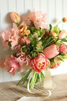 a bouquet of flowers sitting on top of a table