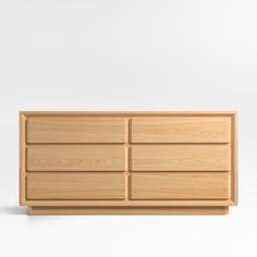 an empty wooden dresser with four drawers