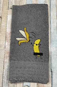 a towel with a cartoon character on it and a banana hanging from the back of it