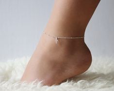 "This beautiful cross anklet will be sure to add that pizazz to compliment any outfit. A fun piece to accessorize your summer looks to add that final touch. Yes you can shower, swim with your anklet. Made with 100% 14K gold filled or Sterling Silver  ● FIND YOUR SIZE ● ◦ Wrap a measuring tape around your ankle just below the ankle bone, then add 1/4\" or 1/2\" to the measurement depending on the desired fit ◦ If you don't have access to a measuring tape wrap a string around your ankle and measur Cross Anklet, Sterling Silver Initial Necklace, Anklet Silver, Beautiful Anklet, Silver Anklet, Beach Anklets, Beautiful Cross, Gold Anklet, Sterling Silver Initial